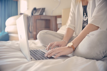 Businesswoman writing on laptop
