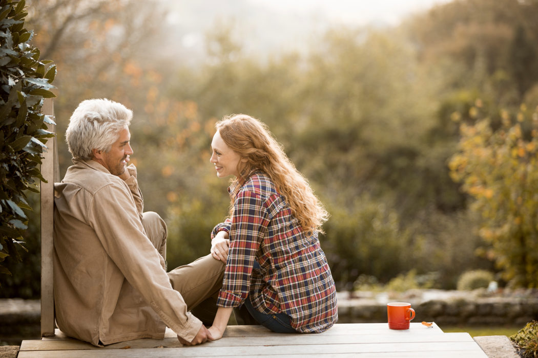 Man and woman sitting on porch